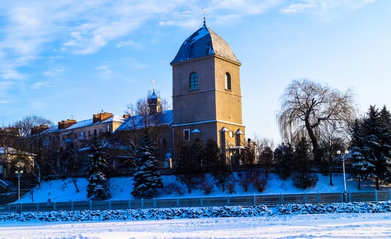 beautiful old Church on the background of blue sky in winter