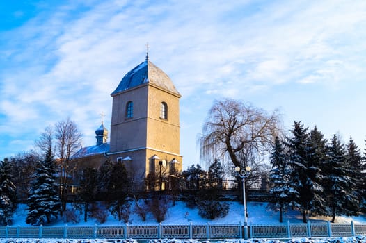 beautiful old Church on the background of blue sky in winter