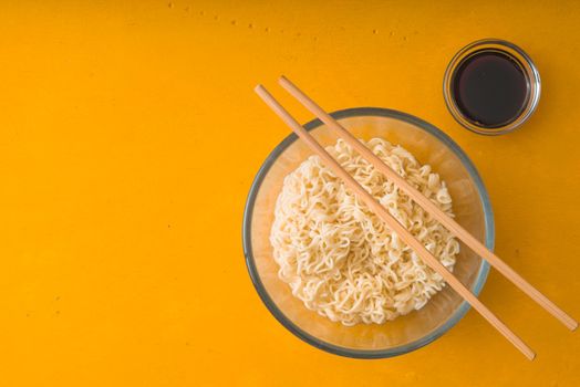 Soup Ramen noodles in glass bowl and soy sause horizontal