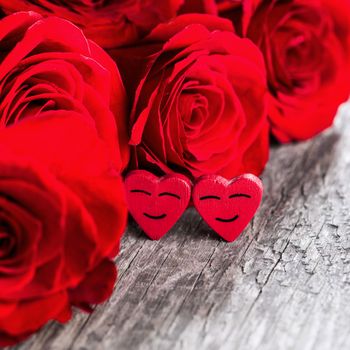 Rose and happy hearts on old wooden background, Valentines day