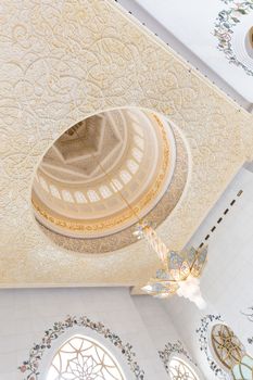 Rich artistic islamic interior of Sheikh Zayed Grand Mosque in Abu Dhabi, United Arab Emirates.