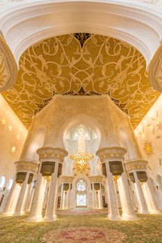 Rich artistic islamic interior of Sheikh Zayed Grand Mosque in Abu Dhabi, United Arab Emirates.