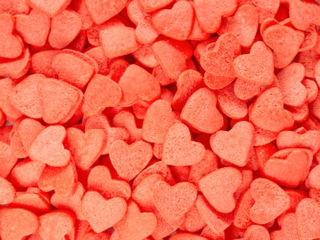 Candy heart confetti as background. Copy space. Top view or flat lay. Close up