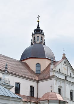 The view of the Catholic Church of corpus Christi in Niasvizh, Belarus on the background of the pale sky.