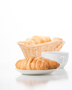 Fresh and delicate croissants served with coffee.