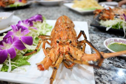 lobster with garilc on table