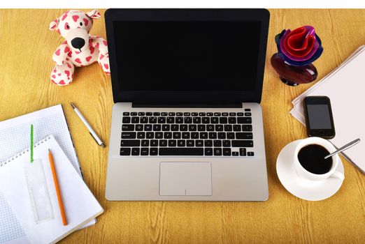 Mock up objects such as computer, smartphone on a wooden background, front view