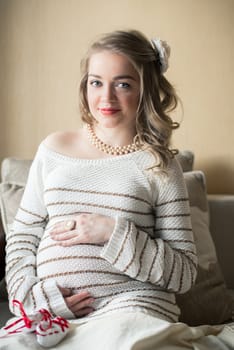 Portrait of a pregnant woman in the room