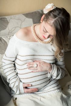 Portrait of a pregnant woman in the room