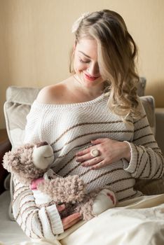 Portrait of a pregnant woman in the room