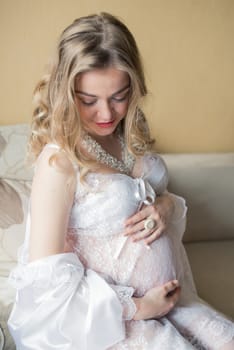 Portrait of a pregnant woman in the room