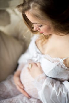 Portrait of a pregnant woman in the room