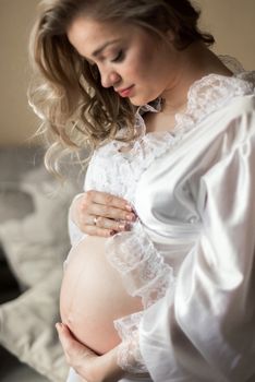 Portrait of a pregnant woman in the room