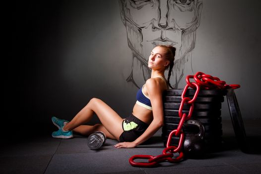 one young attractive woman with sports equipment chain