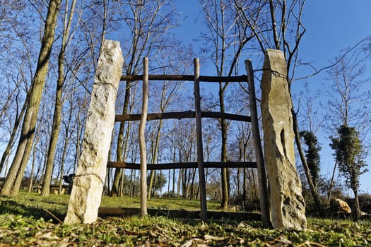 wooden gate in the nature under blue sky