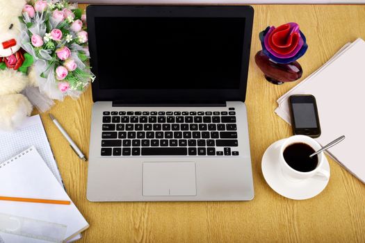 Mock up objects such as computer, smartphone on a wooden background, front view