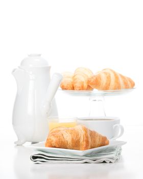 fresh buttery croissants served with coffee and juice.