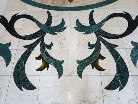 A pattern, design, on a tile floor