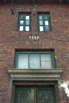 discarded ruin with old windows and wall, industrial window in concrete wall