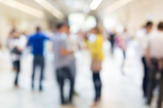 Abstract blurred people socializing during coffee break at business meeting or conference.