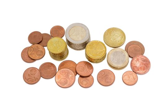 Several euro coins from 1 to 50 cents, and in denominations of 1 and 2 euro partly stacked and partly scattered on a light background
