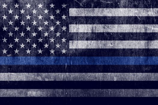 An aged textured law enforcement support flag with a thin blue line.
