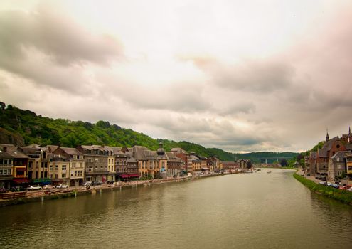 Landscape of Meuse River in Waterfront of Dinant, Belgium in Cloudy Day Outdoors. Retro Styled