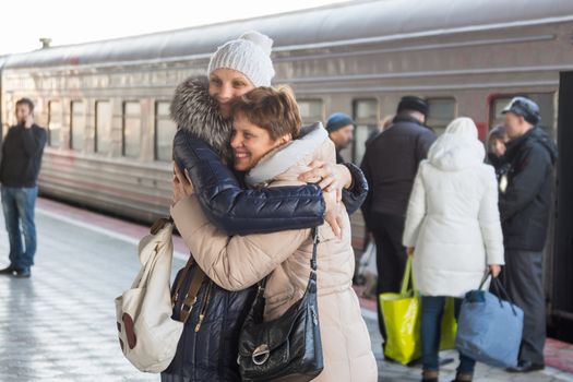 Adult daughter met my mother at the train at the station