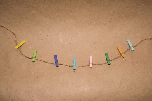 Colorful wooden clothespin. Background of colorful clothes pegs. Closeup of colorful clothespins.

