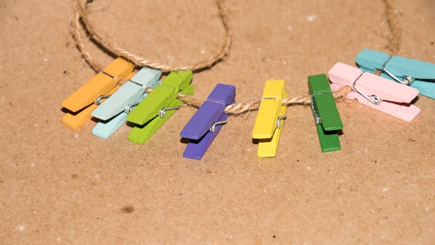 Colorful wooden clothespin. Background of colorful clothes pegs. Closeup of colorful clothespins.

