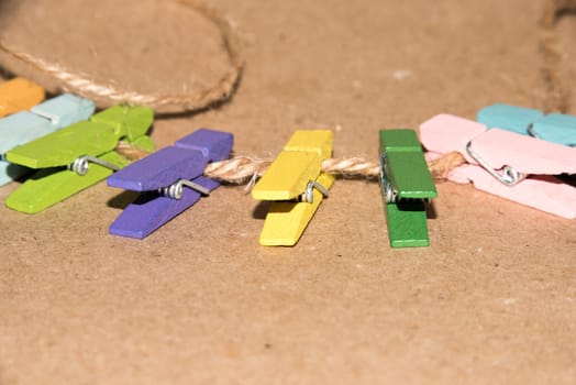 Colorful wooden clothespin. Background of colorful clothes pegs. Closeup of colorful clothespins.

