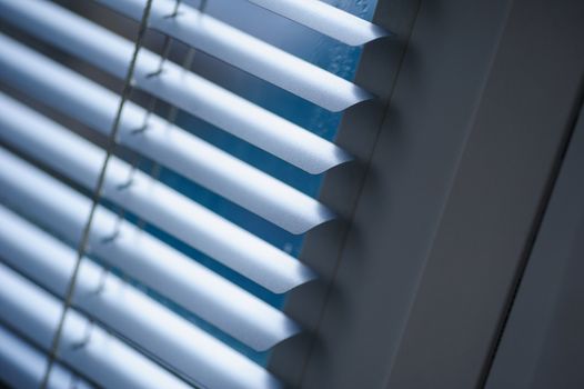 White shutters on the window in the Office.