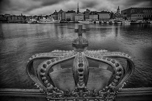 Skeppsholmsbron (Skeppsholm Bridge) with Golden Crown on a bridge in Stockholm, Sweden ( black and white photo)