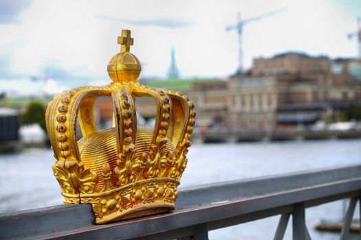 Skeppsholmsbron (Skeppsholm Bridge) with Golden Crown on a bridge in Stockholm, Sweden