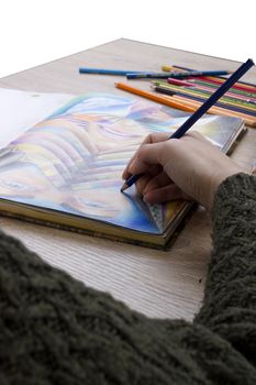 Drawing and pencils for drawing on a wooden table