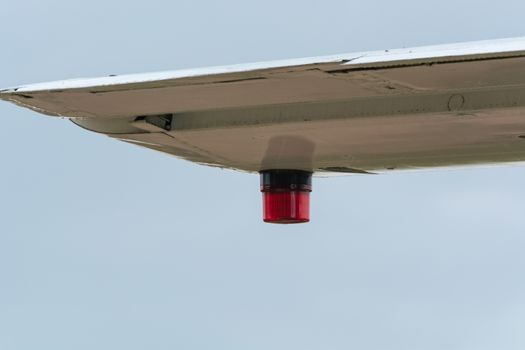 Wing of an airplane with position lighting.