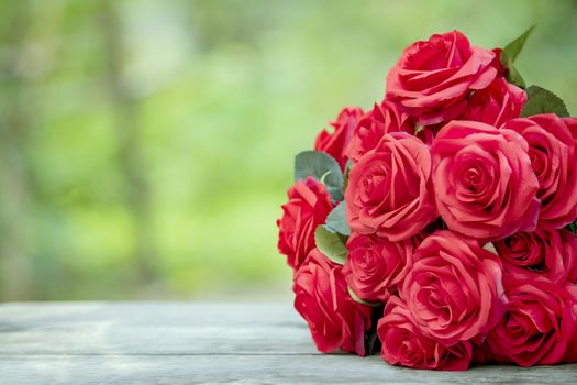 close up beautiful red roses bouquet with glowing light background for valentine day and love theme