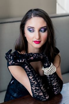 Portrait of a beautiful girl with long hair and makeup