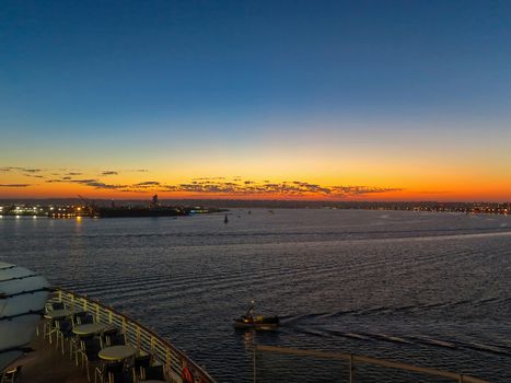 A sunset over the water from a cruise ship