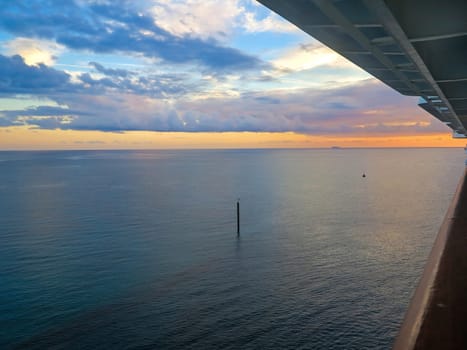 A sunset over the ocean from a cruise ship