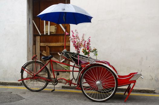 Georgetown, Penang, Malaysia - April 18, 2015: Classic local rickshaw in George Town, Penang in Malaysia