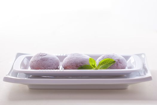 Chocolate coconut mochi ice cream on white background 