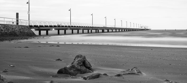 Black and white image of Shorncliffe Pier in Queensland, Australia.
