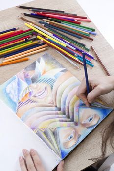 Drawing and pencils for drawing on a wooden table