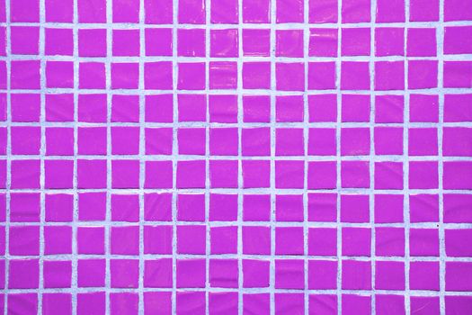 Texture of fine little ceramic tiles background. Purple floor tiles