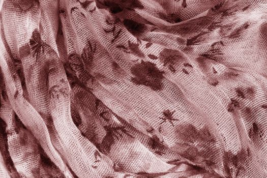 Flower patterned crumpled fabric texture background. Foulard made from modal and cashmere with a positional floral print