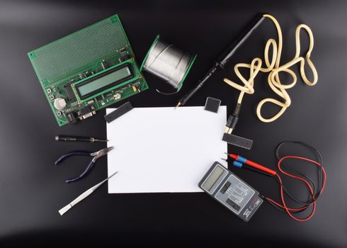 Mock up objects such as industrial controllers on a black background with copy space, top view