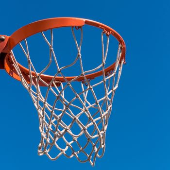 Detail of Baskeball hoop on a sunny day.