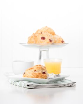Fresh cranberry lemon scones served with coffee and juice.