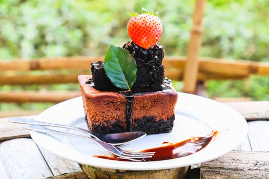 chocolate cake on white dish with strawberry